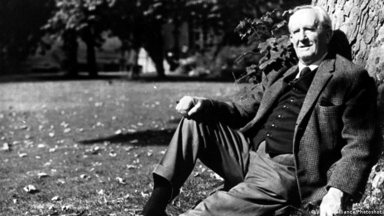 J.R.R. Tolkien sitting against a tree, deep in thought