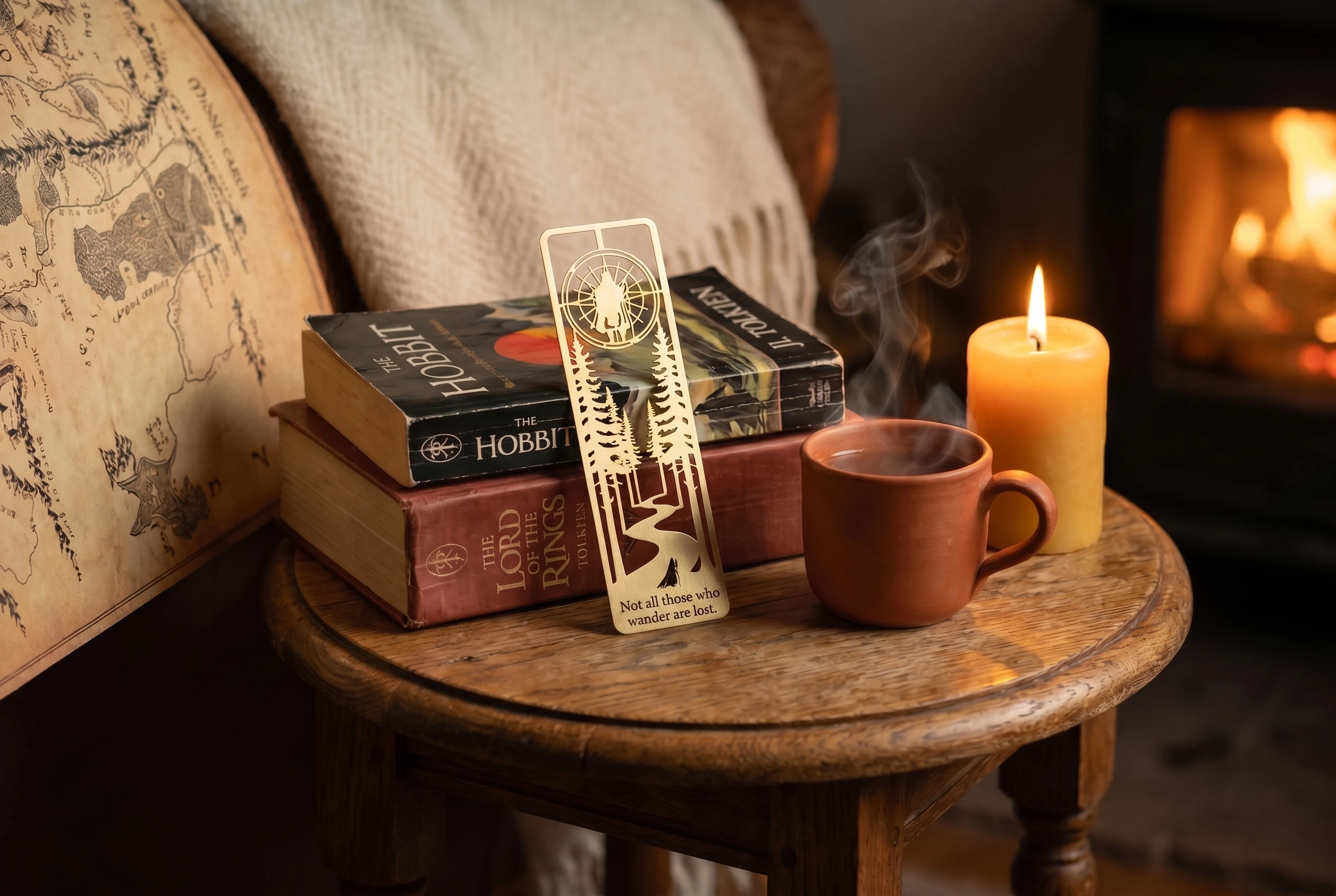 The brass bookmark resting on a closed cloth-bound volume of The Lord of the Rings, lit by a beeswax candle in a warm hearth setting.